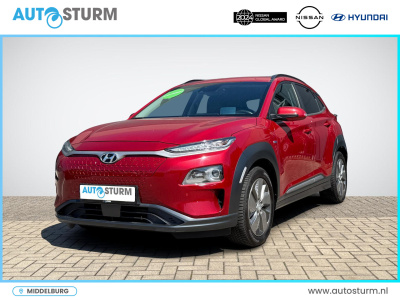 Hyundai Kona ev premium 64 kwh | head-up display | navigatie | camera | leder | adapt. cruise control | stuur- + stoelverwarming | rijklaarprijs!