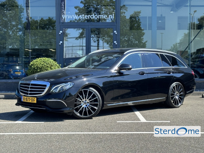 Mercedes-Benz E-Klasse estate 200 premium luxury l panorama dak l massage l camera l memorypakket l stoelverwarming l sfeerverlichting l elek trekhaak l l elektrische achterklep l led high performance l apple carplay l dodehoekpakket i comand i ...