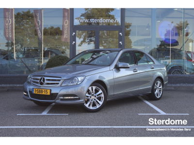 Mercedes-Benz C-Klasse 180 prestige avantgarde i trekhaak i lederen bekleding i tempomaat i stoelverwarming i i navigatie i airco i goed onderhouden i