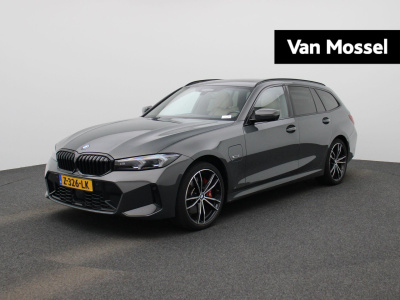 BMW 3-serie touring 330e xdrive | automaat | lmv | head up dsiplay | trekhaak | sfeer verlichting | harman kardon | navigatie | schuifdak | stoel/stuur verwarming | virtual cockpit | leder | parkeer sensoren | elec. achterklep | virtu...