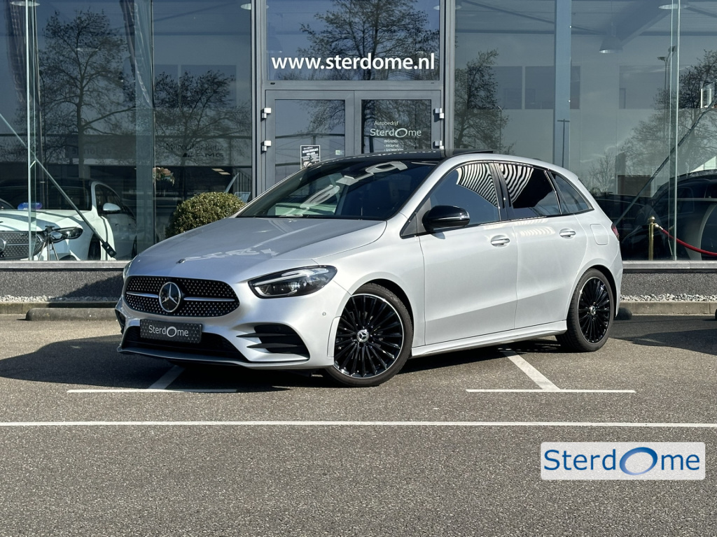 Mercedes-Benz B-Klasse 200 amg line l distronic l panoramaschuifdak l mbux l achteruitrijcamera l multispaaks l sportief motorgeluid l keyless l stoelverwarming l multibeam l draadloos opladen voor l