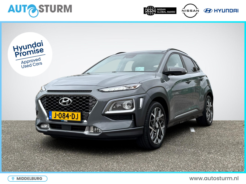 Hyundai Kona 1.6 gdi hev premium | trekhaak | head up-display | leder | stoelverwarming + -ventilatie | led koplampen | premium audio | rijklaarprijs!