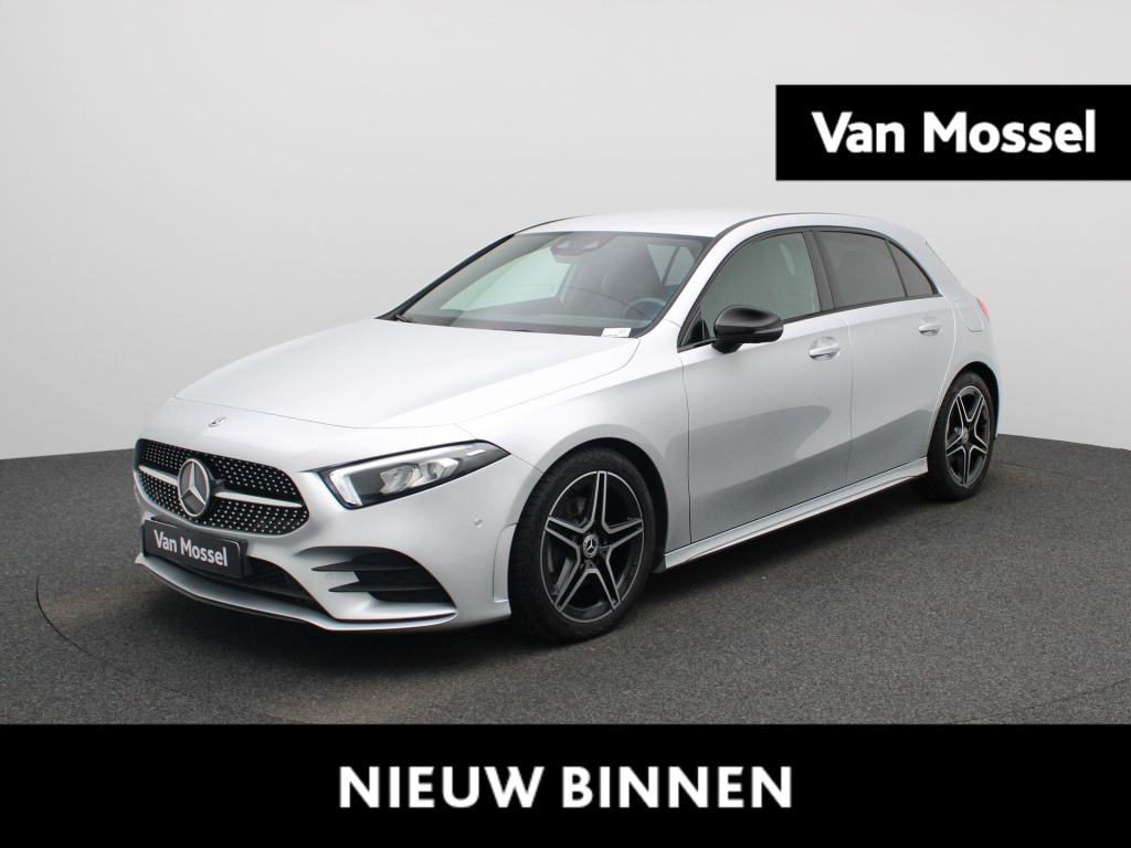 Mercedes-Benz A-Klasse 180 business solution amg | automaat | half leder | bluetooth | navigatie | camera | climate control | cruise control | stoel verwarming | dab |
