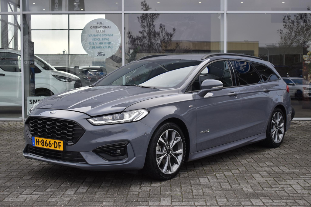 Ford Mondeo wagon 2.0 ivct hev st-line | automaat | unieke kleur: stealth (ford rs) | climate control | cruise control | winterpakket | elektrisch verstelbare stoelen incl. memory | achteruitrij camera | elektrischbedienbare kofferkle...