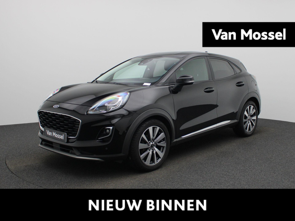 Ford Puma 1.0 ecoboost hybrid titanium | automaat | lmv | trekhaak | navigatie | stoel/stuur verwarming | winter pack | half leder | elec. achterklep | climate control | parkeer sensoren | cruise control | dab | camera |