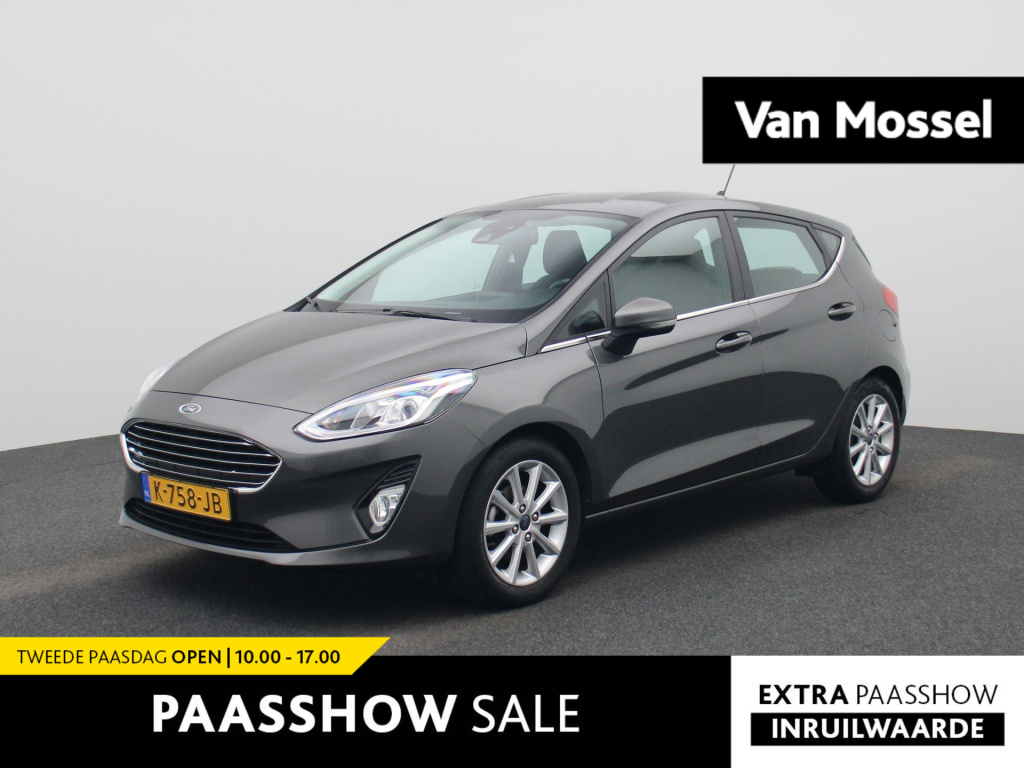 Ford Fiesta 1.0 ecoboost titanium | winterpack | stoel/stuur verwarming | lmv | parkeer sensoren | cruise control | bluetooth | navigatie | climate control | apple carplay | dab