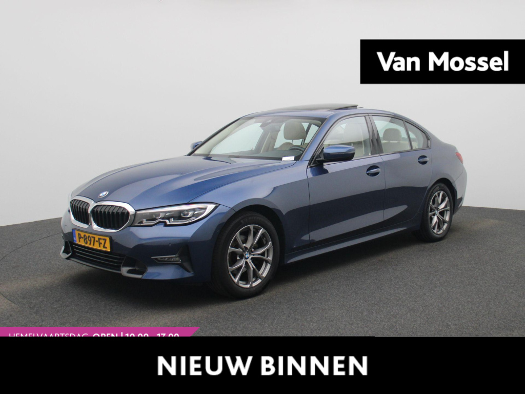 BMW 3-serie 318i business edition | automaat | schuifdak | trekhaak | leder | dab | virtual cockpit | apple carplay | navigatie | stuur verwarming | climate control | parkeersensoren | lichtmetalen velgen |