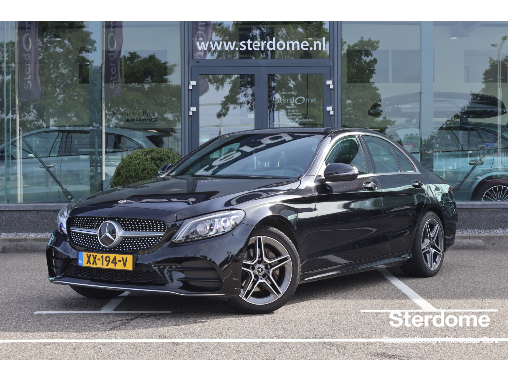 Mercedes-Benz C-Klasse 180 business solution amg i trekhaak i camera i stoelverwarming i tempomaat i multibeam led i virtual cockpit i pts l i nederlandse geleverd i automaat i dealer onderhouden i btw auto i essen hout i