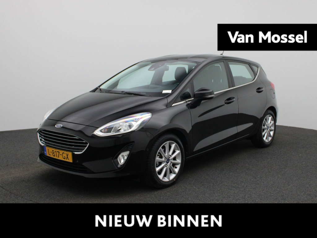 Ford Fiesta 1.0 ecoboost titanium | automaat | winterpack | stoel/stuur verwarming | lmv | keyless | parkeer sensoren | cruise control | bluetooth | navigatie | climate control | apple carplay | dab